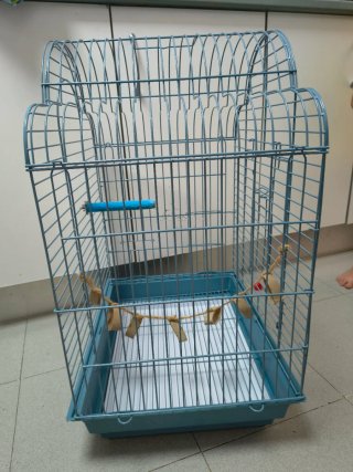 Dos jaulas para pájaros azul prácticamente nuevas