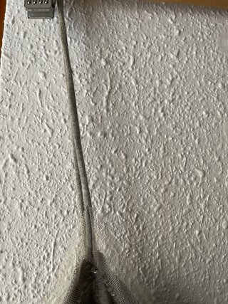 Top gris con lentejuelas y tirantes, marca Xdye