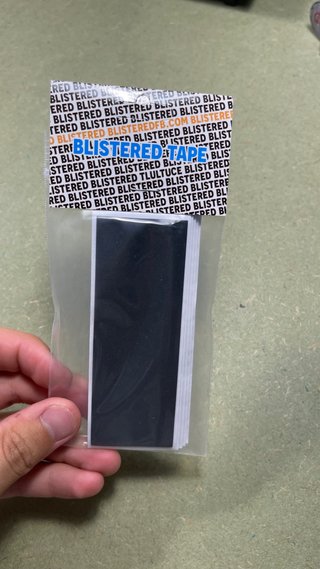 Tape blistered fingerboard
