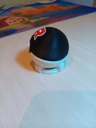 Poké Ball Team Rocket antiestrés con botón clicky
