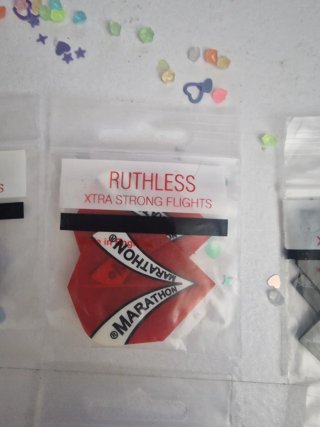 paquetes plumas dardos Ruthless