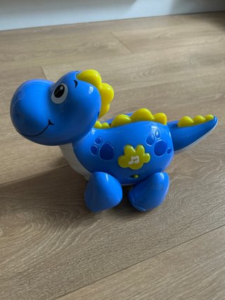 Dinosaurio de juguete musical azul
