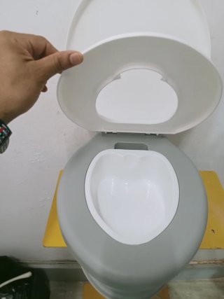 Orinal infantil con diseño de jirafa con mósica