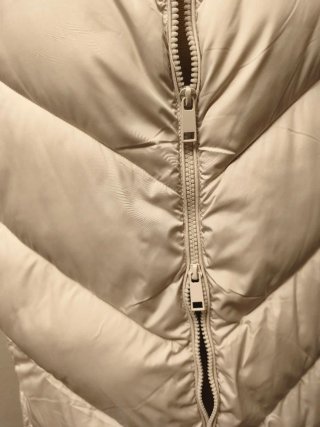 Chaleco acolchado beige claro