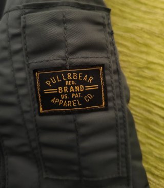 Chaqueta bomber gris y verde oliva