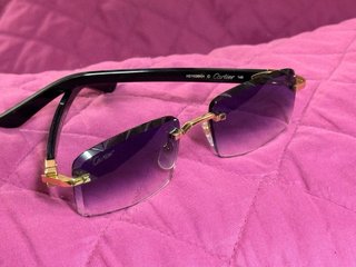 Gafas de sol Cartier doradas y moradas