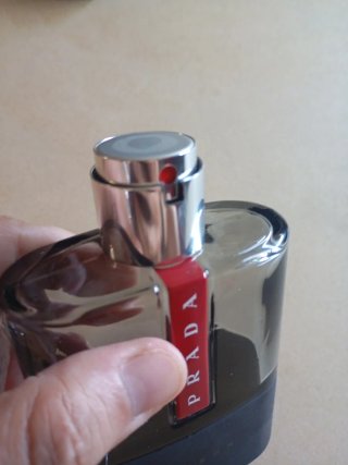 Conjunto Neceser Prada Ocean y frasco vacío Carbon