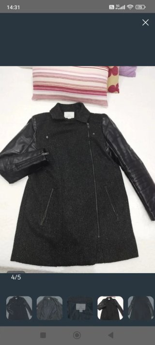 Falda y abrigo negro con mangas de cuero