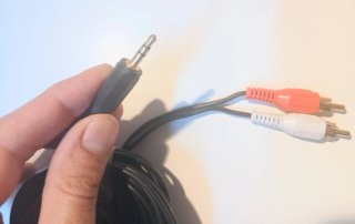 Cable audio estéreo: J 3,5 mm → RCA (rojo y blanco