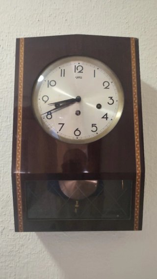 Reloj de pared SARS marrón y dorado