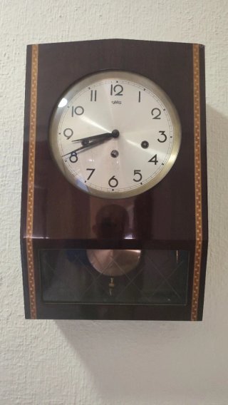 Reloj de pared SARS marrón y dorado