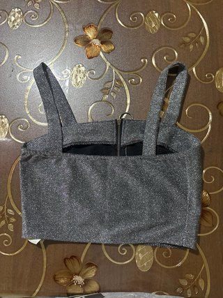 Top glitterato con zip e anello