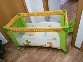 Cuna de viaje infantil con diseño de dinosaurios