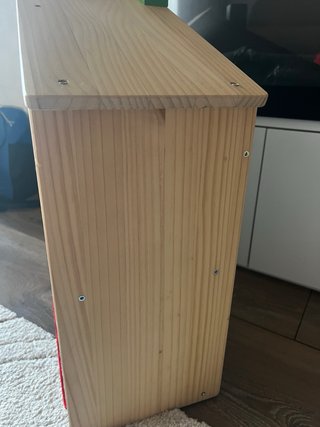 Casa de muñecas de madera y plástico