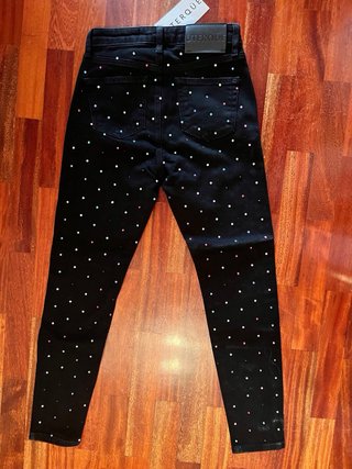 Pantalón negro con brillos Uterqüe talla 36