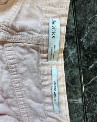 Pantalón pata elefante rosa desgastado
