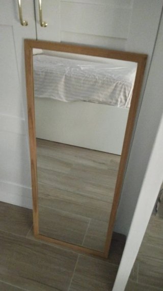 Espejo con marco de madera 40x97 cm.