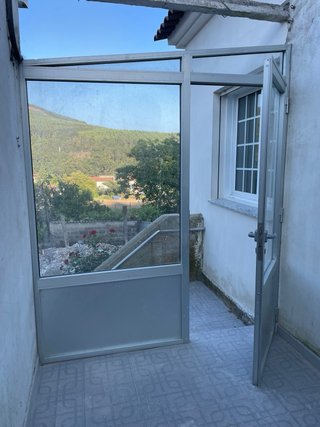 Puerta aluminio con fijo lateral
