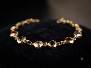 Pulsera dorada corazones cristales