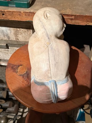 Escultura asiática durmiendo