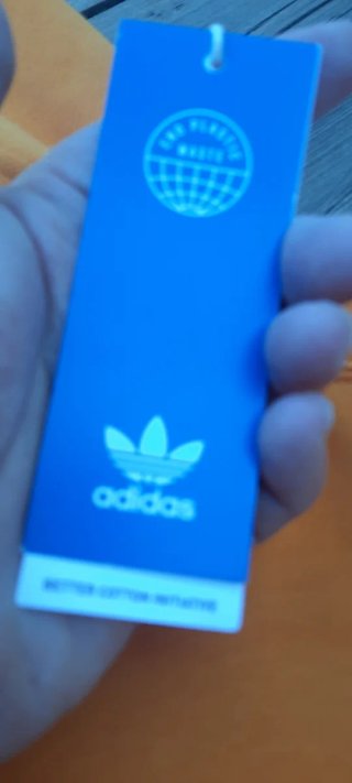 Felpa Adidas arancione con strisce