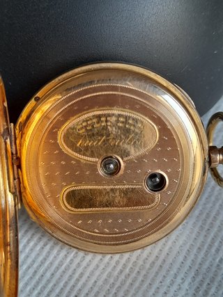 Orologio antico in oro con chiave