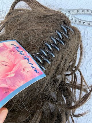 Coda di capelli veri castani lunghi mossi