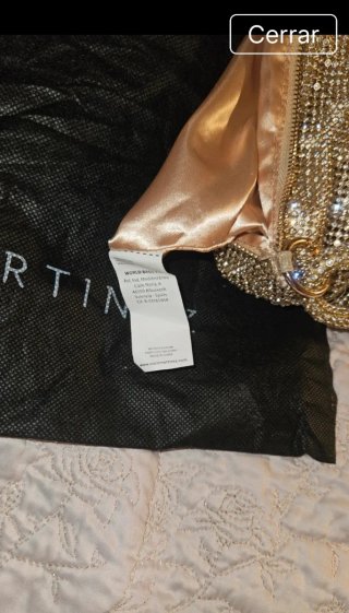 Bolso de fiesta dorado con pedrería