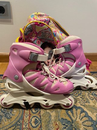 Patinetes en línea Oxelo rosas y blancos