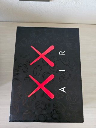 Jordan 4 Kaws Grigie