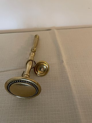Agarradera de cortina en metal dorado