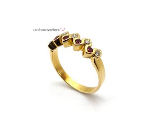 anillo oro 18k con piedra con diamante,rubi