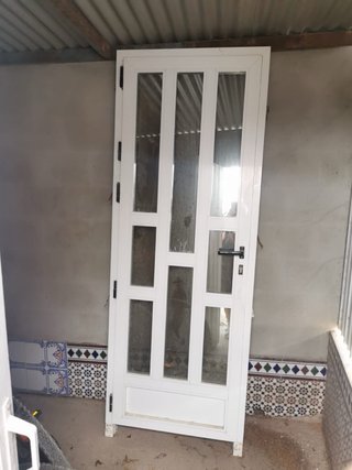 Puerta aluminio con cristales