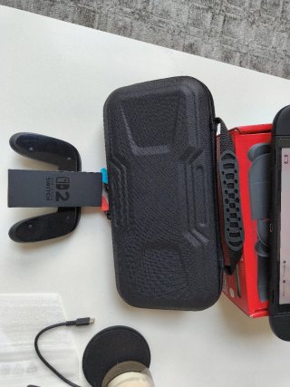 Nintendo Switch Negra + Mario Kart world con funda