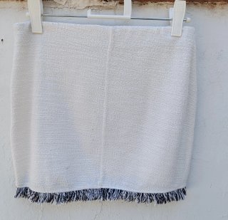 Conjunto top y falda blanco con flecos