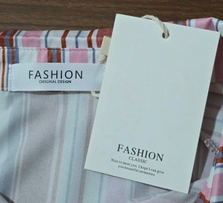 Camisa de rayas multicolor con elástico en puños.