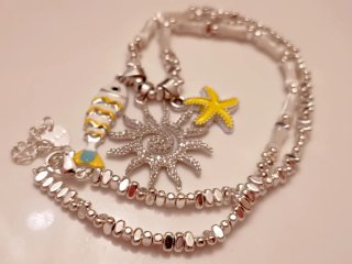 Collana con pesciolino, sole e stella marina