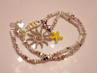 Collana con pesciolino, sole e stella marina