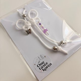 Colgante charm mariposa blanco y morado BTS