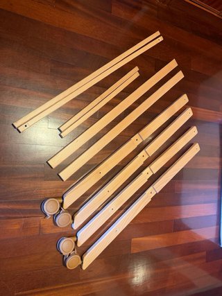 Minicuna Cambrass con patas, ruedas y vestimenta