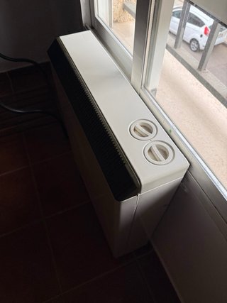 Acumulador de calor beige y negro