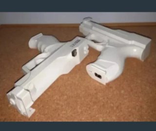 NUEVO. 2 Pistolas y 2 Rifles WII