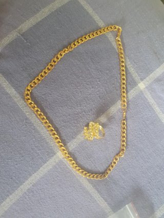 Cadena y colgante dólar oro