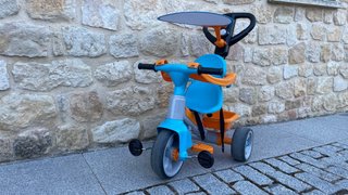 Triciclo infantil naranja y azul