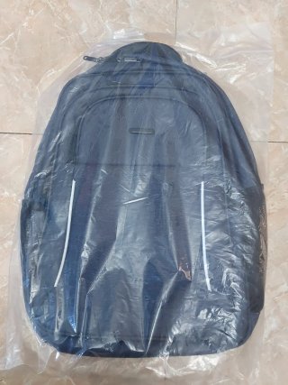 Mochila gris multibolsillos nueva