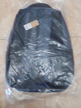 Mochila gris multibolsillos nueva