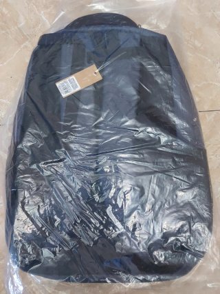 Mochila gris multibolsillos nueva