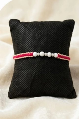 Pulsera tejida con balines de plata
