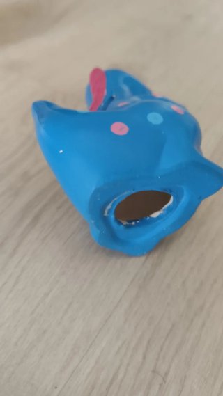 Hucha dinosaurio azul con puntos y con deposito