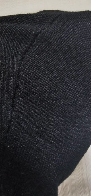 Chaqueta corta de punto con tachuelas plateadas